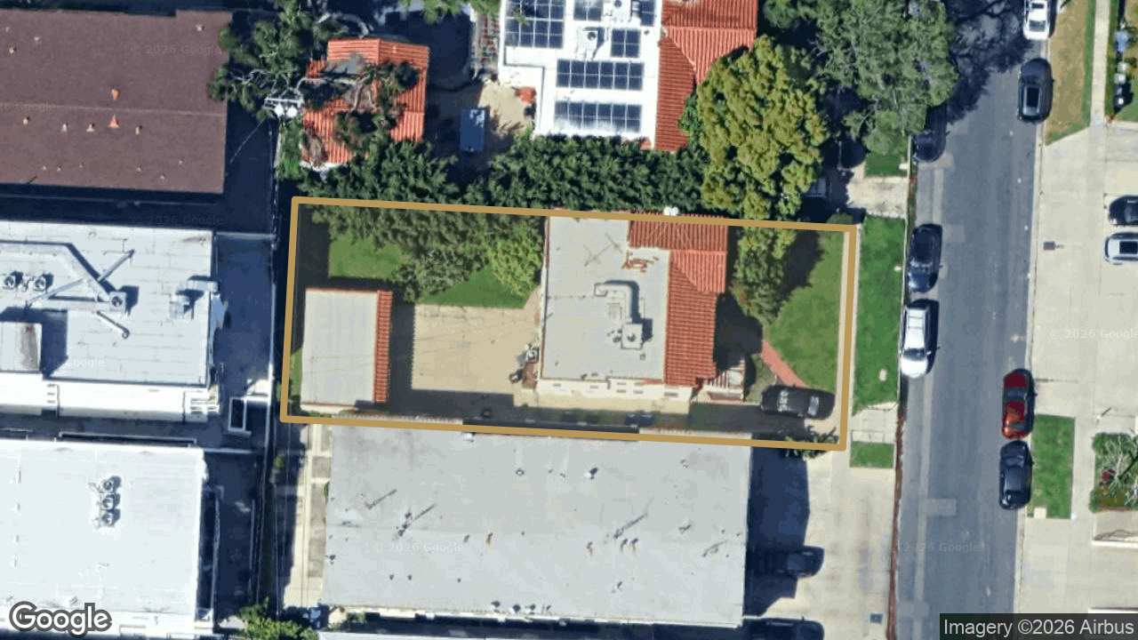 Aerial view of 1129 S Bedford St with the lot outlined in gold
